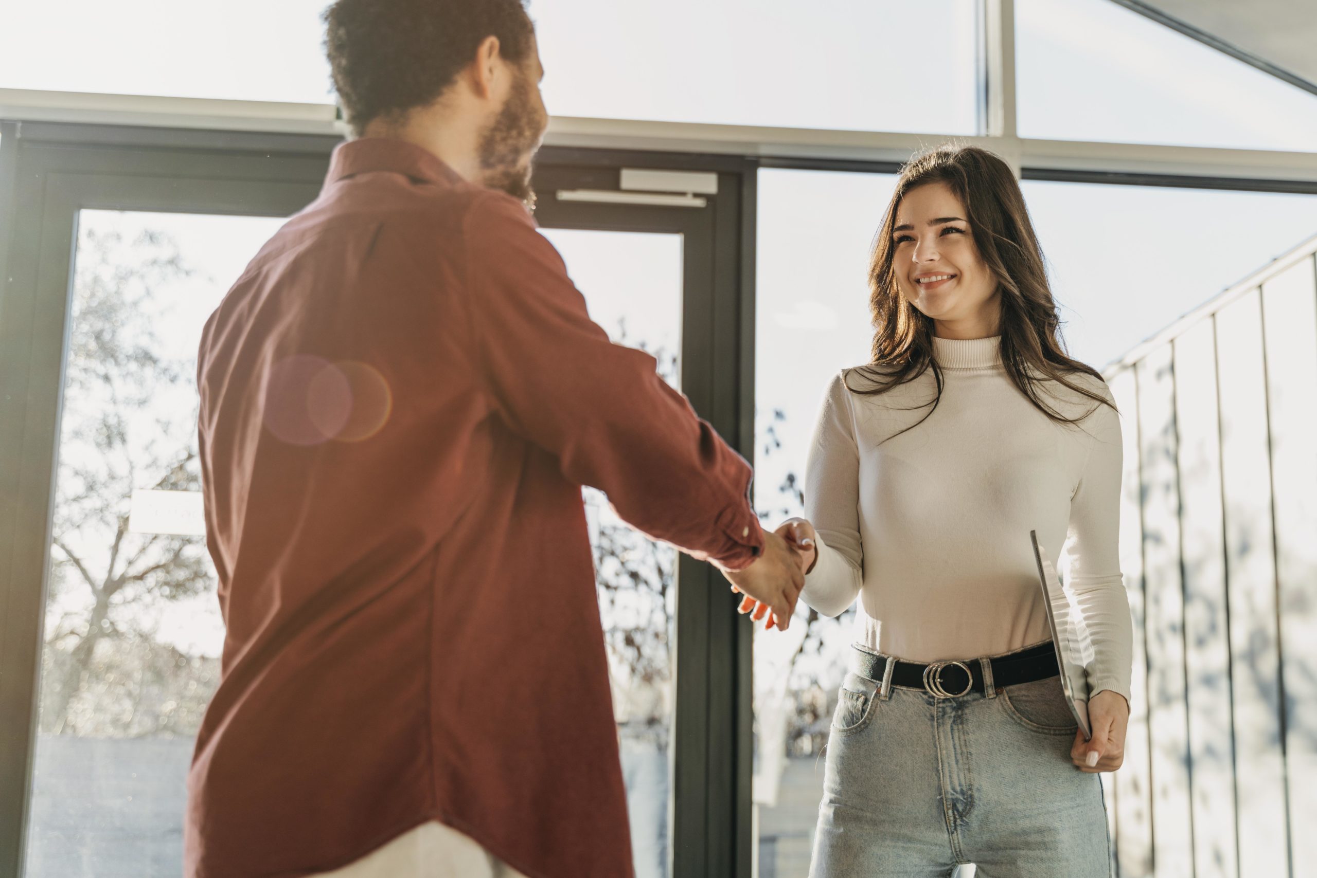 low-angle-business-people-hand-shake